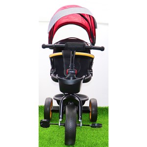 سه چرخه فلزی با سایه بان رنگ قرمز